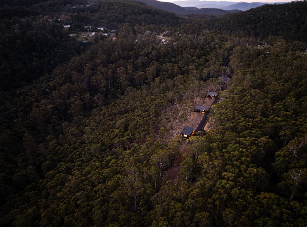 Drone picture of 3 cabins overlooking the forest