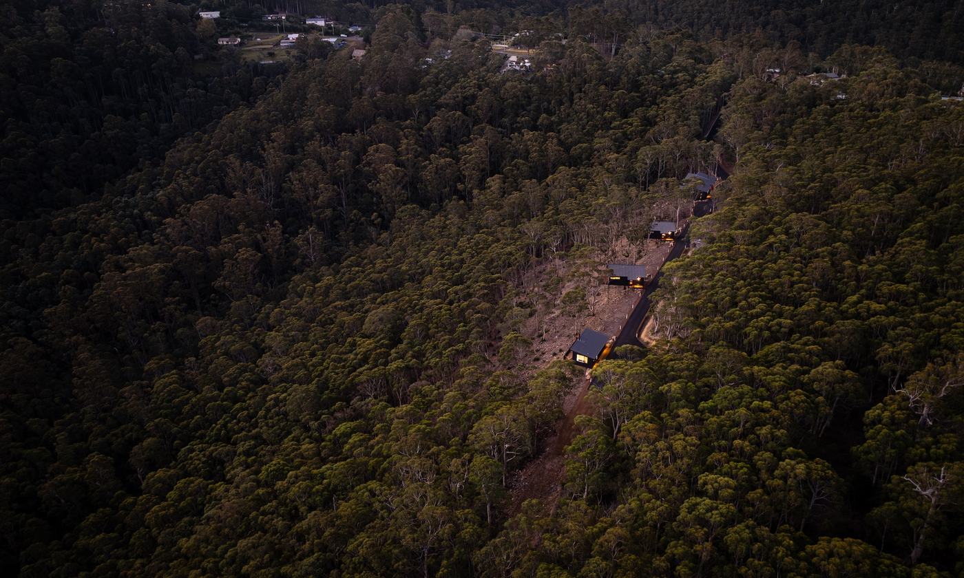 Drone picture of 3 cabins overlooking the forest